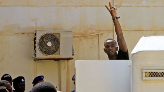 The suspects displayed peace signs as they were brought to court [Getty]