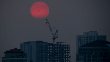 A crane seen next to towers being built in Myanmar's city of Yangon in 2020.