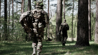 Two British soldiers in a forest