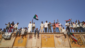  MAY 03: Protesters chant above the crowds from the railroad track on May 03, 2019 in Khartoum, Sudan. Thousands of demonstrators continued their mass sit-in outside military headquarters in Khartoum to call on the country's military rulers to cede control. (Photo by David Degner/Getty Images)