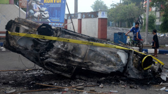 According to the police, at least 127 people were killed when angry fans invaded a football pitch after a match in Indonesia late on October 1, 2022. [Photo by PUTRI/AFP via Getty Images]