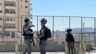 Israeli soldiers patrol the entrance of the Shuafat Refugee Camp in occupied East Jerusalem.