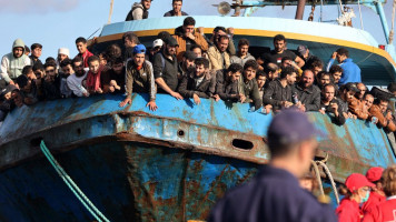 The arrests happened after hundreds of migrants were rescued from a fishing boat [Getty]