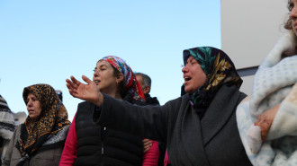 Raziye Toparli mourns the loss of her daughter and husband, killed after a building collapsed in Iskanderun, southern Turkey following a deadly earthquake on Monday morning. [William Christou/TNA] 