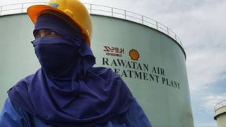 A Worker is pictured at oil and gas processing facilities at Seria, September 7, 2004 in Brunei. Brunei produces around 218,000 barrels a day of crude oil and natural gas liquids and is a the major income of the South East Asian Sultanate