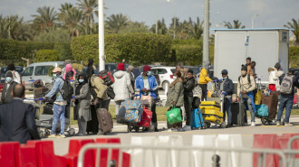 Citizens of the Ivory Coast gather required paperwork from Ivory Coast Embassy in Tunis 