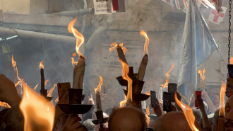 Christians celebrate the "miracle" of "Holy Fire" in the Old City of Jerusalem on 15 April 2023. Ibrahim Husseini/TNA