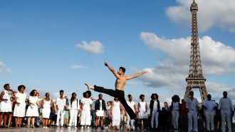 Syrian choreographer Ahmad Joudeh performs on the Human Rights Square in Trocadero