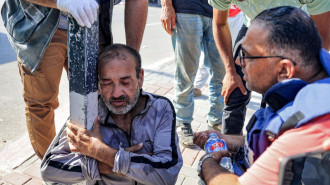 Some of the workers collapsed as soon as they crossed the border [AFP/Getty]