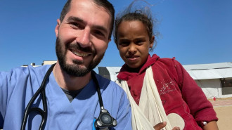 Dr. Mohammad Subeh poses with a young patient in Gaza. [Photo courtesy of Mohammad Subeh]