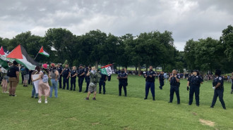 Pro-Palestinian protesters face off with police near the Washington Monument in the US capital. [Brooke Anderson/TNA]