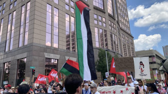 Demonstrators march on the first day of the Republican convention. [Brooke Anderson/TNA]