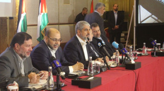 Khaled Meshaal (third from left) and Musa Abu Marzouk (second from left) have been named as potential successors to assassinated Hamas leader Ismail Haniyeh [Getty]