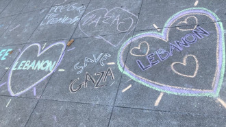 Activists draw chalk art in support of Gaza and Lebanon. [Brooke Anderson/TNA]