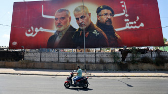 A billboard bearing portraits of Haniyeh, Soleimani, Shukr