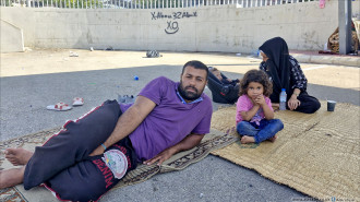 Family sleeping on street in Sidon