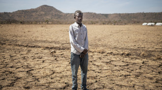 Alsadig Osman, 58, a refugee from Sudan, poses for a portrait on the outskirt of the newly established Awulala refugee camp, near Maganan, 80 km from the Sudanese border in Ethiopia's Amhara region, on February 28, 2024.