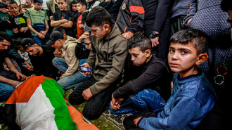 Palestinian children mourn loved one in West Bank [Getty]