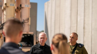 Israeli Defense Minister Yoav Gallant (L) visits the site, where the 'Arrow-3' air defense system battery is located, as he meets Israeli soldier in Israel in July 31, 2024. (Photo by Ariel Hermoni/IMoD - Handout/Anadolu via Getty Images)