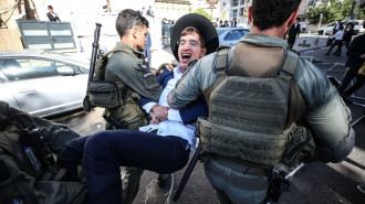 Israeli police officers intervene in Ultra-Orthodox Jews, also known as Haredim, who gather to stage a protest against mandatory military service in West Jerusalem, Israel, on August 21, 2024. (Photo by Saeed Qaq/NurPhoto via Getty Images)