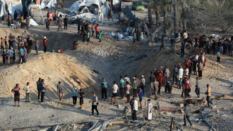 Palestinians inspect the damage at the site of Israeli strikes on a makeshift displacement camp in Mawasi Khan Yunis in the Gaza Strip on September 10, 2024.