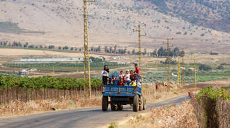 Syrian refugees leave the southern Lebanese village of Wazzani after the Israeli army dropped leaflets calling for them to evacuate on September 15, 2024. (Photo by Rabih DAHER / AFP) (Photo by RABIH DAHER/AFP via Getty Images)