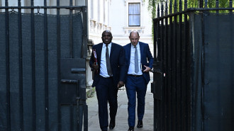 Britain's Foreign Secretary David Lammy (L) and Permanent Under-Secretary at the Foreign, Commonwealth & Development Office (FCDO) Philip Barton, arrive in Downing Street in central London on September 17, 2024. 