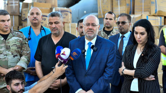 	Lebanon's Health Minister Firass Abiad (C) speaks to reporters from Beirut International Airport on September 18, 2024 after the arrival of an Iraqi Air Force C-130 Hercules military transport aircraft with a shipment of emergency medical aid provided by Iraq to Lebanon.  (Photo by FADEL ITANI/AFP via Getty Images)