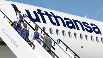 Lufthansa crew members dressed in traditional Bavarian clothes (Trachten crew) are seen during a photo shooting ahead of their flight to Osaka, at Franz Josef Strauss airport in Munich, southern Germany, on September 20, 2024.