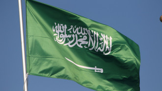 The national flag of the Kingdom of Saudi Arabia, fluttering in the wind on a flagpole in Saint Petersburg, Russia. 