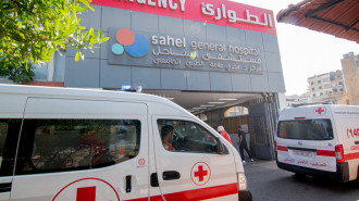 Ambulances and paramedics carry people wounded in Israeli bombing of Beirut's southern suburbs to the Sahel General Hospital on September 28, 2024. (Photo by FADEL ITANI/Middle East Images/AFP via Getty Images)