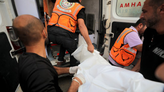 The bodies of Palestinians are brought to morgue of Al-Awda Hospital in the aftermath of an Israeli attack on a house in Nuseirat Refugee Camp in Deir Al-Balah, Gaza on October 05, 2024. (Photo by Hassan Jedi/Anadolu via Getty Images)