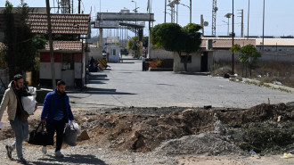 A crater caused by an Israeli strike on the road leading to Syria's Jousieh border crossing with Lebanon on October 28, 2024