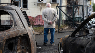  An elderly man is seen next to the burnt cars that became unusable after the drone attacks carried out by Russia with 'Shahed' and 'Gerbera' unmanned aerial vehicles at night in Kyiv, Ukraine on October 29, 2024. 