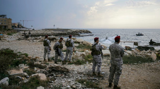 Lebanese soldiers inspect the beach at a landing site for a naval commando force which abducted a Lebanese mariner according to a military source, in the northern coastal town of Batroun on November 2, 2024. (Photo by IBRAHIM CHALHOUB/AFP via Getty)