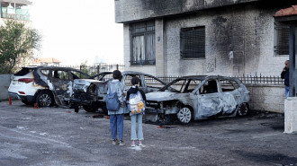 Aftermath of burned Palestinian vehicles in West Bank [Getty]