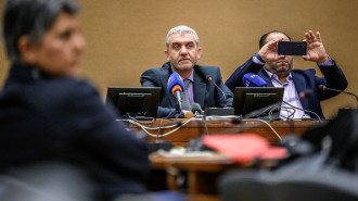 Lebanon Labour Minister Mustafa Bayram (C) during a press conference after filing a complaint to the ILO against Israel over the pager and walkie-talkie attacks carried out in last September, in Geneva on November 6, 2024. (FABRICE COFFRINI/AFP)