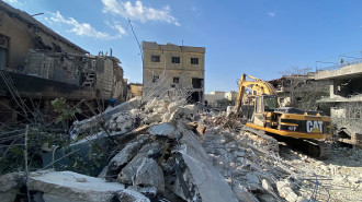 Rescue teams search for survivors and remove the rubble at the site of an Israeli airstrike that targeted Baalbek's al-Shiqan densely populated district in Lebanon's eastern Bekaa Valley on November 7, 2024.