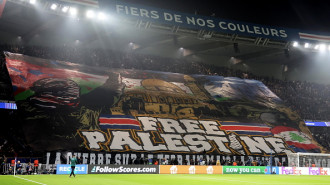 Paris Saint-Germain fans unfurled a large 'free Palestine' banner at the match [Getty]