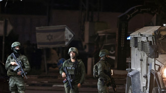 Israeli soldiers stand at the Deir Sharaf checkpoint west of Nablus in the occupied West Bank, after a man was reportedly killed at the site, on November 12, 2024. (Photo by ZAIN JAAFAR/AFP via Getty Images)