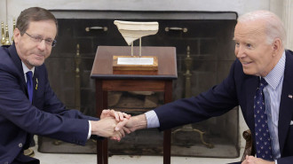  President Isaac Herzog (L) of Israel presents to U.S. President Joe Biden (R) with an artifact from the foot of Temple Mount in Jerusalem that has the word "Joseph" on it during a meeting in the Oval Office of the White House on November 12, 2024 in Washington, DC. Biden met with Herzog to discuss the peace process in Gaza and Lebanon. 