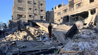 A man stands amid the rubble of a building hit in an overnight Israeli strike in Beit Lahya in the northern Gaza Strip on November 17, 2024. (Photo by AFP) (Photo by -/AFP via Getty Images)