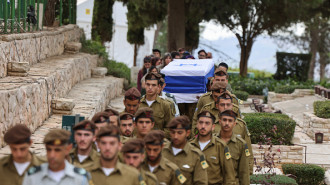 Israeli soldiers carry the coffin of Sergeant first class (res.) Omer Moshe Gealdor during his funeral at the Mount Herzl military cemetery in Jerusalem on November 20, 2024. (Photo by MENAHEM KAHANA/AFP via Getty Images)