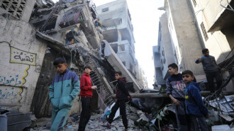 Palestinians inspect damage at the scene following an Israeli airstrike that hit house of Palestinian Arouq family in Sheikh Ridwan neighborhood located in the north of Gaza City, Gaza