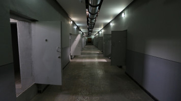 A picture taken on September 2, 2014 in the Iranian capital Tehran shows the doors of cells in a corridor of the "Qasr prison", a former prison hosting political prisoners that was turned into a museum in 2012. 