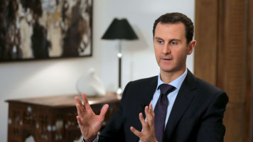 Assad speaking [Getty]