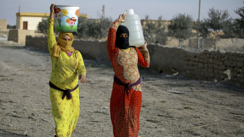 Syrian women in Raqqa [AFP]