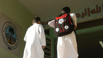 Saudi schoolboys entering their school [GETTY]