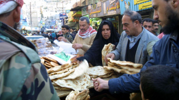 Jordanians bread market - Getty