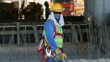 Qatar workers [AFP]